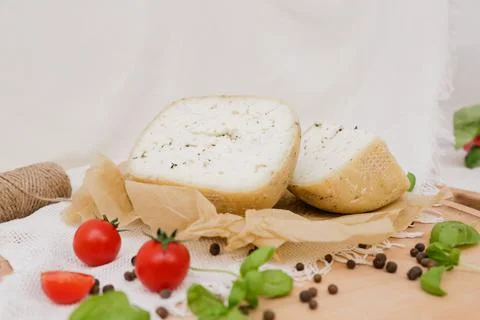 Medium hard cheese head parmesan on wooden board, with cheese parmesan with t 写真素材
