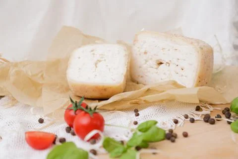 Medium hard cheese head parmesan on wooden board, with cheese parmesan with t 写真素材