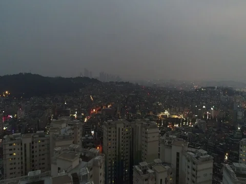 Medium-height flyover of apartments at dusk Stock Footage 77964968