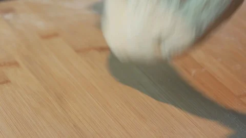 Medium high close up of a man shaping a bread medium size for a pizza base Stock Footage 127974724