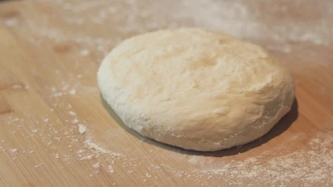 Medium high side close up shaping a pizza dough to round base handmade bread Stock Footage 127973437