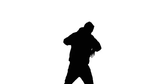 Medium long shot of guy dancing hip hop, freestyle, street dance, silhouette Stock Footage 130319384