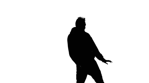 Medium long shot of guy dancing hip hop, freestyle, street dance, silhouette Stock Footage 130319392