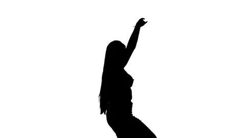 Medium long shot of a woman dancing oriental belly dance, silhouette Stock Footage 128643181