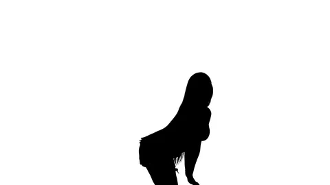 Medium long shot of a woman dancing oriental belly dance, silhouette Vídeo Stock 128643248