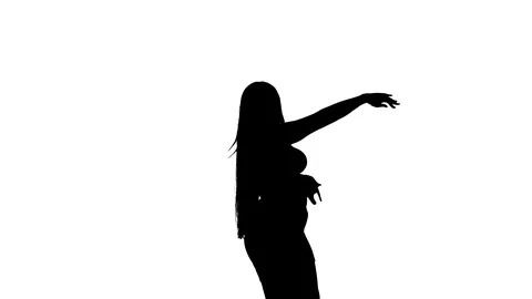 Medium long shot of a woman dancing oriental belly dance, silhouette Video stock 128643295