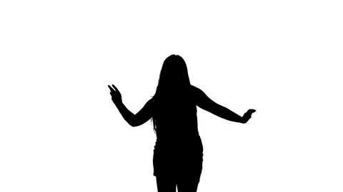Medium long shot of a woman dancing oriental belly dance, silhouette Vidéo 128643365