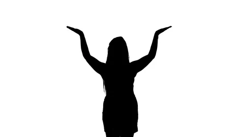 Medium long shot of a woman dancing oriental belly dance, silhouette Vidéo 128643369