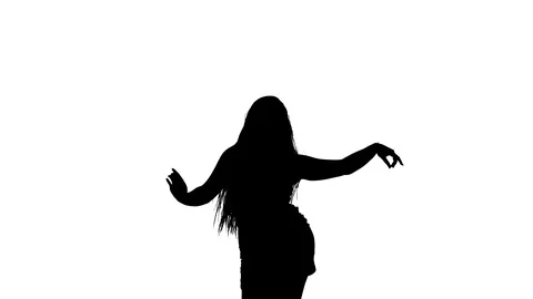 Medium long shot of a woman dancing oriental belly dance, silhouette 库存影片 128643406