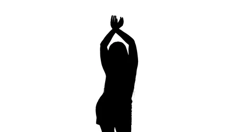 Medium long shot of a woman dancing oriental belly dance, silhouette Vídeo Stock 128643420