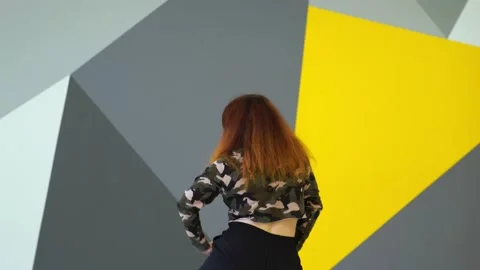 Medium long shot of young energetic woman dancing hip hop in a dance studio. Stock Footage 142820427