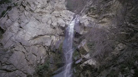 Medium low angle shot of waterfall in canyon Stock Footage 60717022