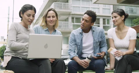 Medium low angle view of diverse group of coworkers exchanging ideas for new Stock Footage 277966007