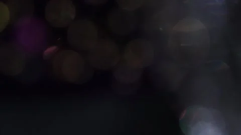 Medium moving colored bokeh in black 库存影片 318663893