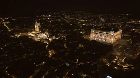 Medium Night Time Aerial Shot of the Alcázar and Cathedral of Toledo, Spain Stock Footage 316902745