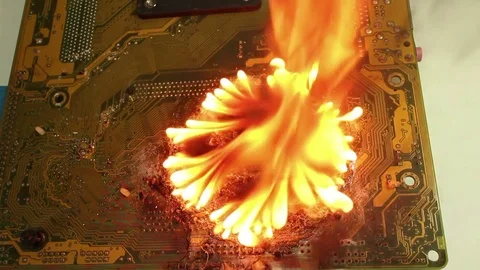 Medium overhead dolly big fire on motherboard Stock Footage 76453201