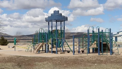 Medium Pan of Quarantined Playground with Caution Tape Stock Footage 127326801