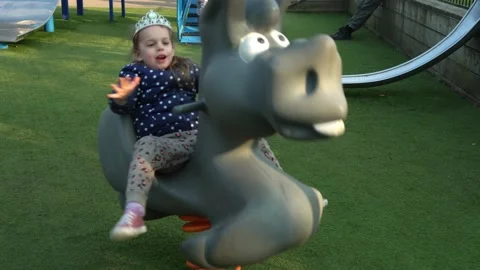 Medium plan Portrait of One cute little Sibling Child preschool girl having fun Stock Footage 173288566