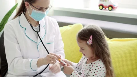 Medium plan of young Caucasian slavic woman nurse or doctor pediatrician Video stock 149274914