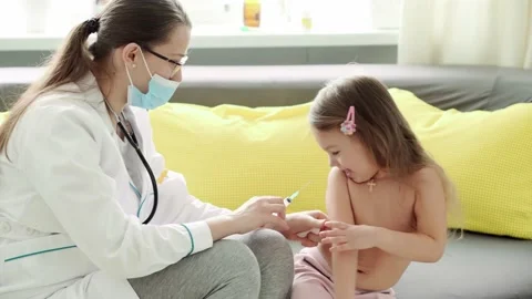 Medium plan of young cute Caucasian slavic woman nurse or doctor pediatrician Stock Footage 149220195