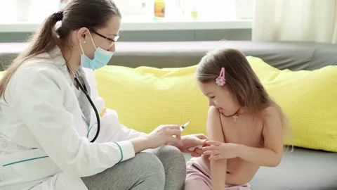 Medium plan of young cute Caucasian slavic woman nurse or doctor pediatrician Stock Footage 149275005