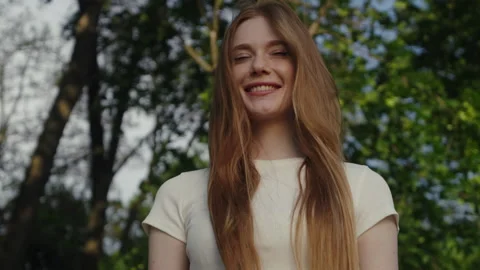 Medium portrait of a beautiful red haired woman with freckles looking away Stock Footage 245752048