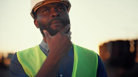 Medium portrait of excited engineer on construction site, foreign professional Stock Footage 318343653