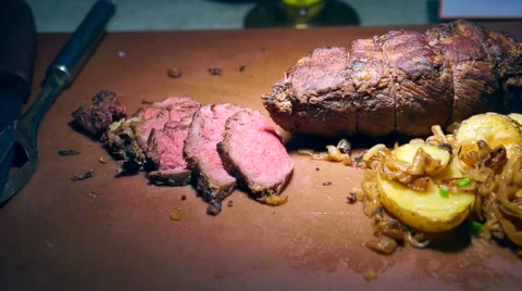 Medium rare beef roasted slices with gravy and potatoes Video stock 56090207