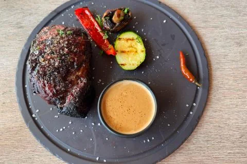 Medium Rare beef steak with grilled vegetables, top view Stock Photos