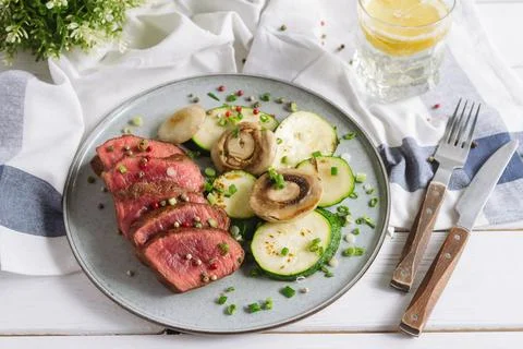 Medium rare meat, almost raw. Sliced roast beef Stock Photos