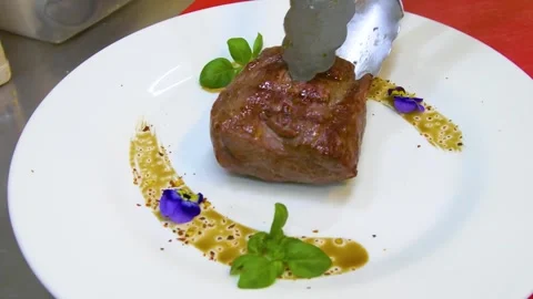 Medium rare steak, beautifully served on a white plate. Stock Footage 290195848