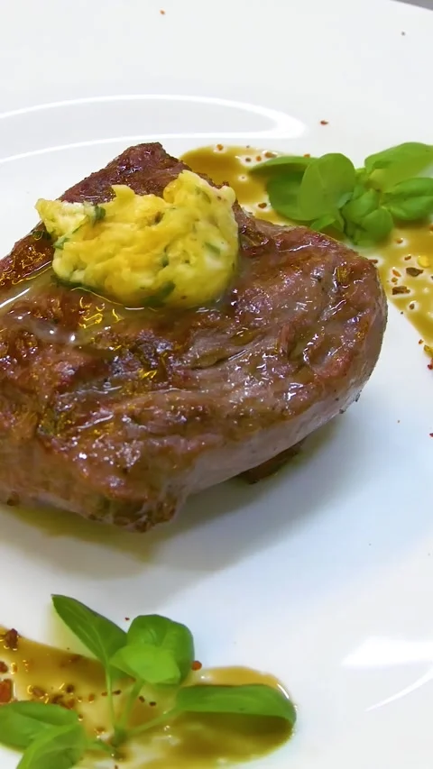 Medium rare steak, beautifully served on a white plate. Vertical video. Stock Footage 290217278