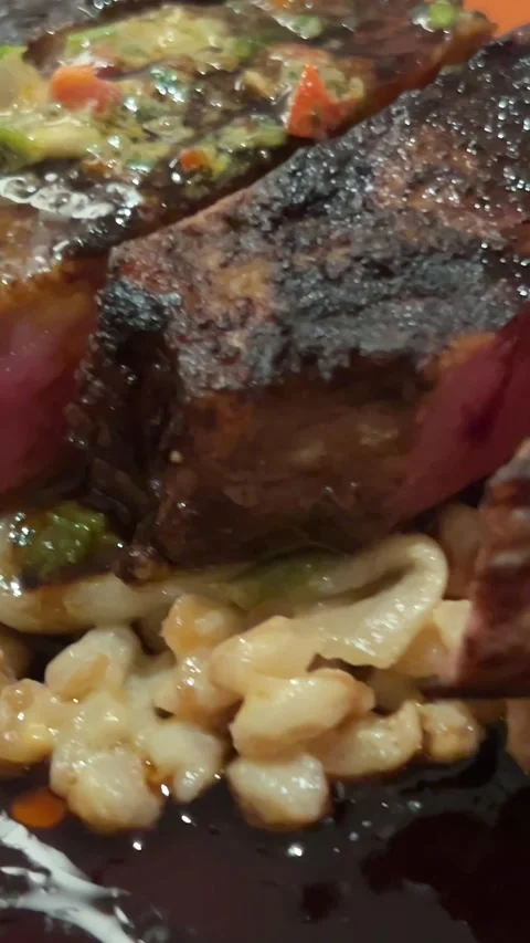 Medium rare steak Close-up of hot tasty steak cut with knife on a wooden board Stock Footage 295422385