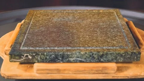 Medium Rare steak on the hot stone Stock Footage 73275512