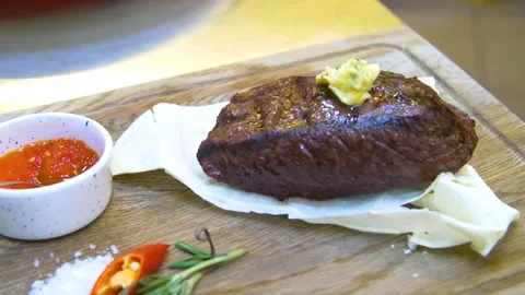 Medium rare steak placed on pita bread on a special wooden board. Stock Footage 290195852