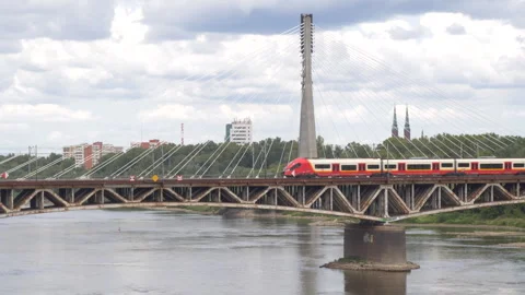 Medium of red tram crossing a bridge over the Vistula River in Warsaw, Poland Stock-Footage 287261814