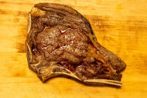 Medium Roasted Tomahawk Steak with Blood Stock Photos