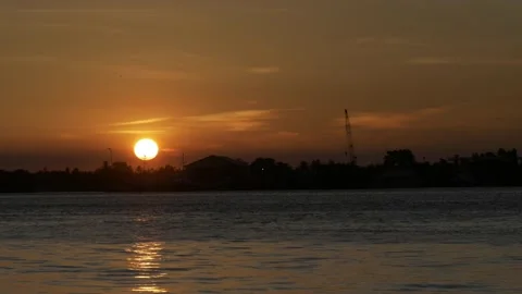 Medium shoot, dramatic red and orange sunset over Barito river Stock Footage 141303428