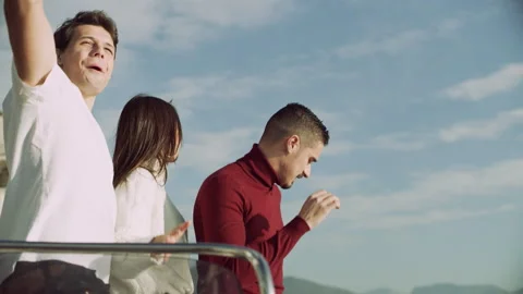 Medium shot on 8k helium RED camera. Group of happy Italian friends cheering and Stock Footage 199453092