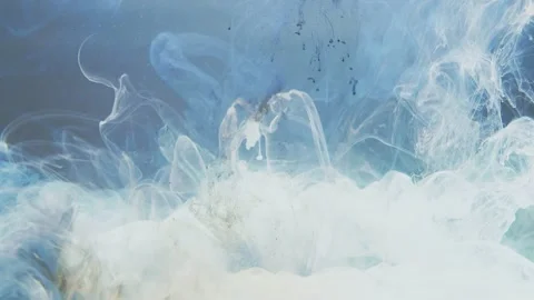 Medium shot of abstract white paint slowly dissolves in water Stock Footage 147314141