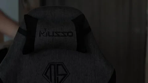 Medium Shot of Adjusting Headrest on Ergonomic Gaming Chair Video stock 335022463