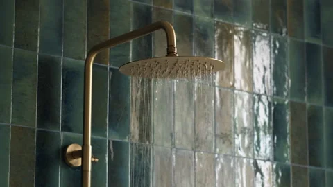 Medium Shot of Antique Copper Shower Head with Flowing Water Stock Footage 330857355