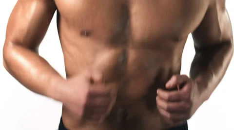 Medium shot of an athletic ethnic man running on a treadmill Stock Footage 33837933