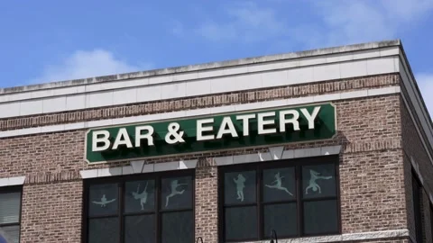 Medium shot Bar and eatery sign day time blue sky morning time Stock Footage 207886099