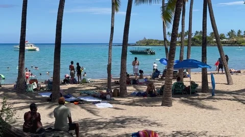 Medium shot of beachgoers and boats at Anaeholomalu Bay, Waikoloa, HI Stock Footage 291465249