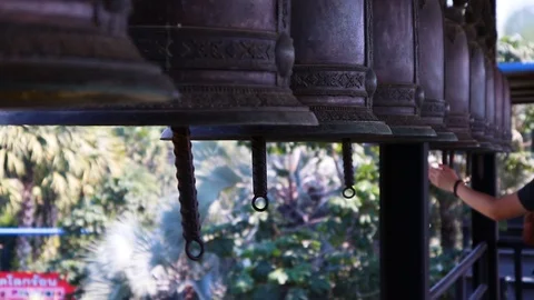 Medium shot of the bells with hand Stock Footage 101245045