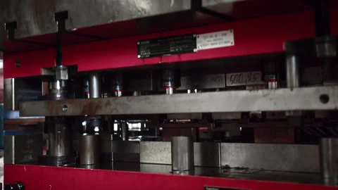 Medium shot of a big automatic hydraulic press molding car parts in a Stock Footage 255221285