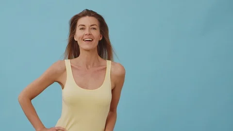 Medium Shot of Blonde Model Wearing Yellow Top Dancing Stock Footage 116728329