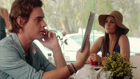 Medium shot of casually dressed man using, worried while using touch screen tabl Video stock 199635024