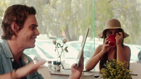 Medium shot of casually dressed man, exited and happy while using touch screen t Video stock 199635052